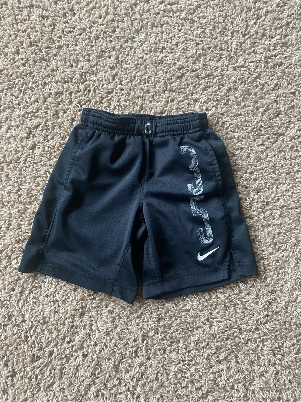 Nike Black Kids Shorts with Silver Graphic and White Swoosh